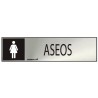 Cartel informativo "aseos" mujer (inox adhesivo 0.8mm) 5x20cm normaluz